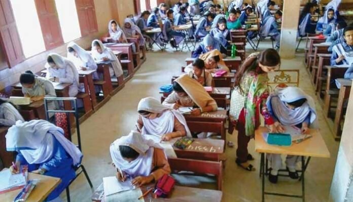 The picture shows girl students sitting in exam-File Photo