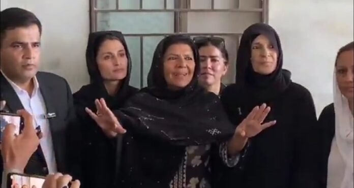 Image shows Imran Khan's sister Aleema Khan's reaction after women hurled egg on her while she was talking to reporters outside Adiala Jail Rawalpindi