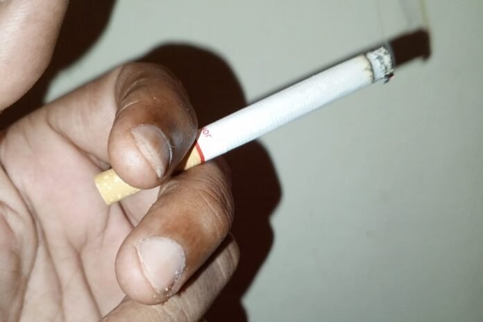 Picture shows a person smoking cigarette-We Punjab