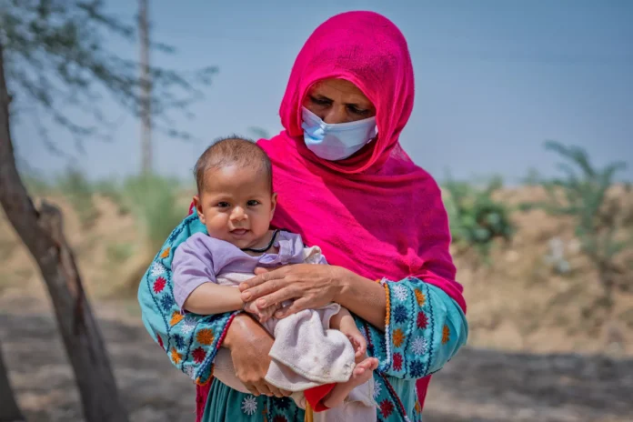 Picture shows a woman holding her child-UNICEF