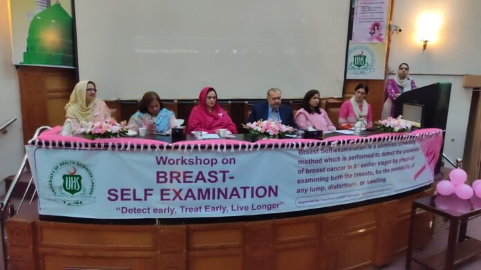 The image shows senior health professional at seminar on cancer awareness-UHS