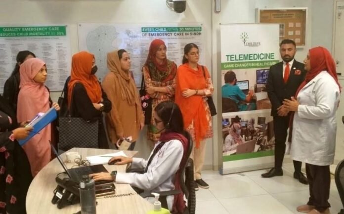 The image shows staff working at telemedicine centre-ChildLife Foundation