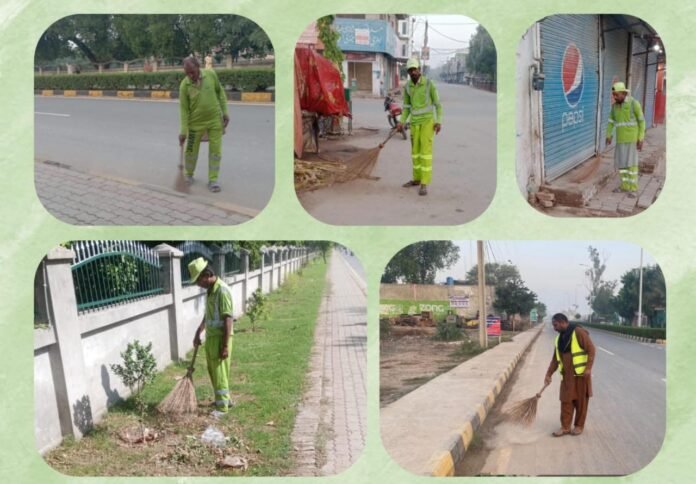 The picture shows workers cleaning roads-Suthra Punjab Program