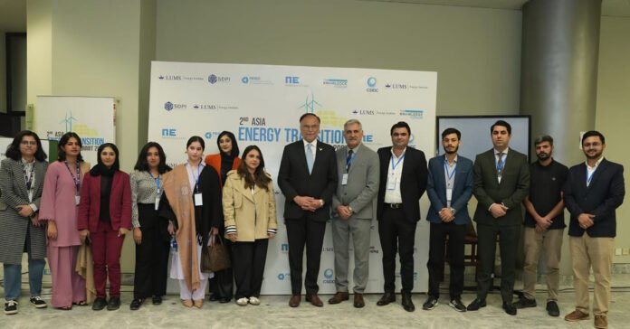 Minister for Planning, Development and Special Initiatives Ahsan Iqbal posing for a group photo with speakers and organisers at the Asia Energy Transition Summit 2025 at LUMS, Lahore.