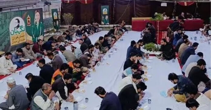 People breaking their fast at Nigehban Dastarkhwan .