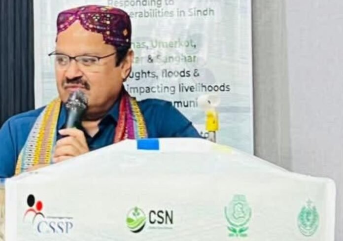 The image shoes the chief guest speaking at seminar on Worth Earth Day.