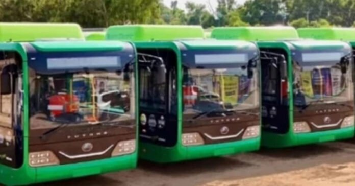 Electric buses at parking stand.